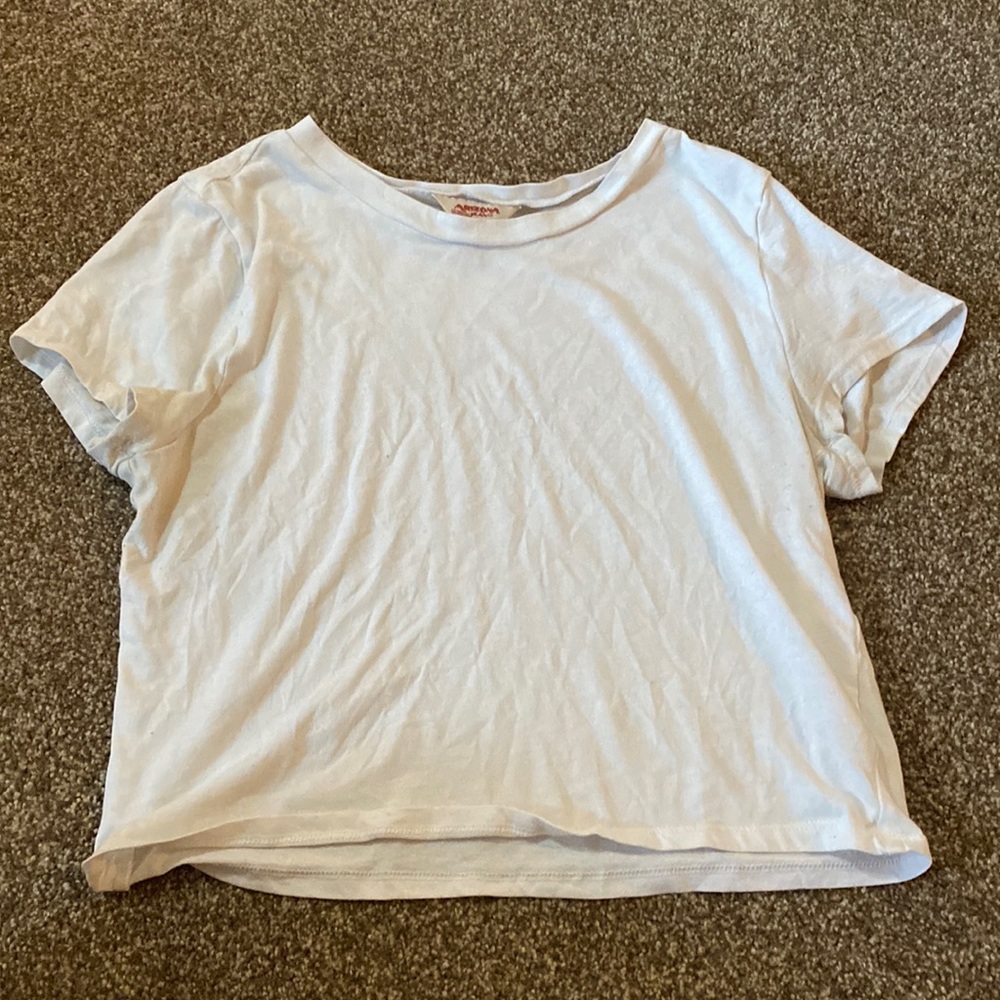 It is a shorter shirt, size M, Brand name is Arizona Jean, and it is white.